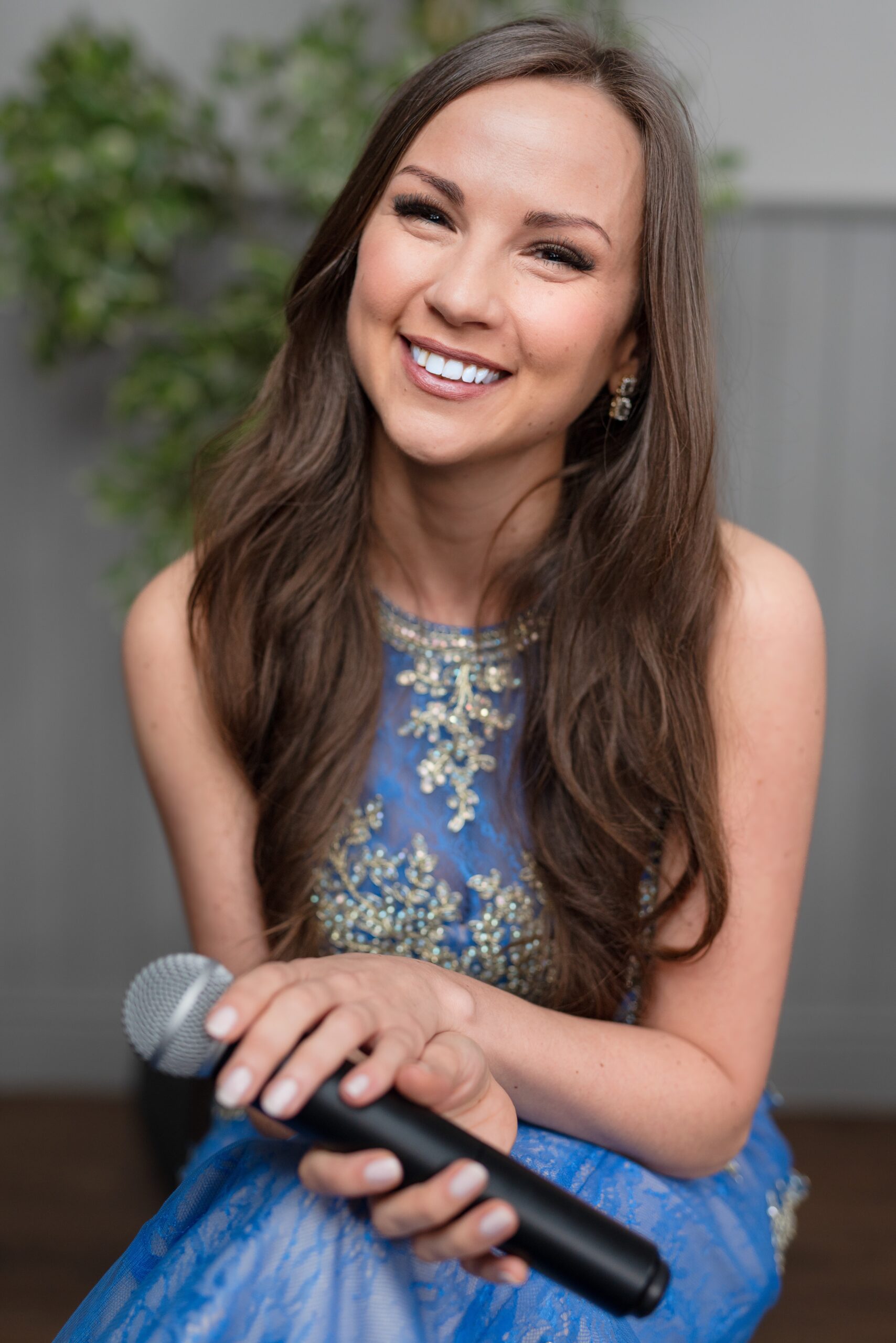 Rhiannon Herridge Soprano in Blue with a Microphone